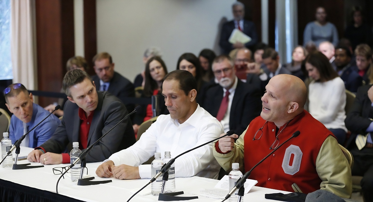 Victims of Dr. Richard Strauss, from right, Michael DiSabato, Mike Schyck, Brian Garrett and Stephen Snyder Hill during an Ohio State University Board of Trustees meeting at the Longaberger Alumni House on Nov. 16, 2018.